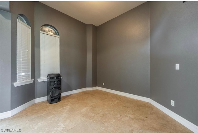 empty room with light tile floors