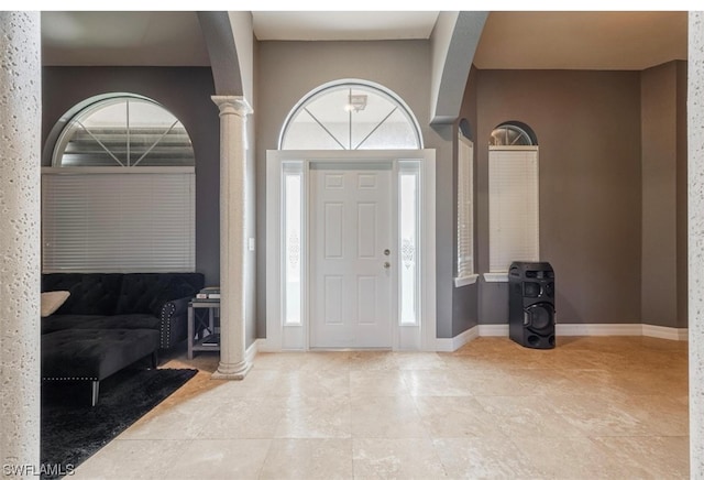 tiled foyer entrance with decorative columns