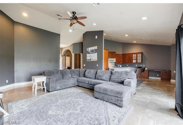 tiled living room with high vaulted ceiling and ceiling fan