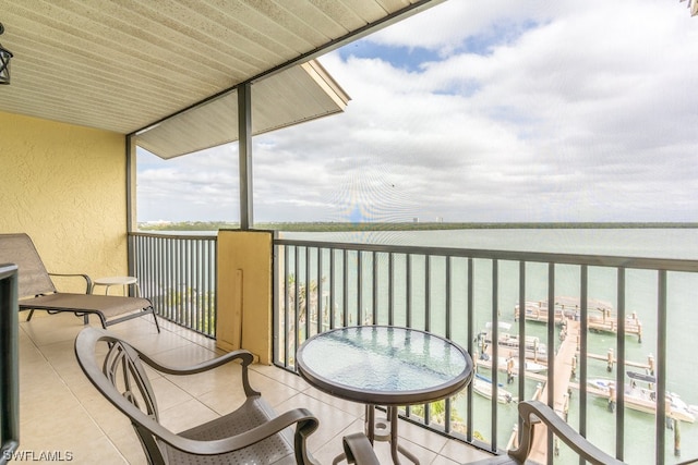 balcony featuring a water view