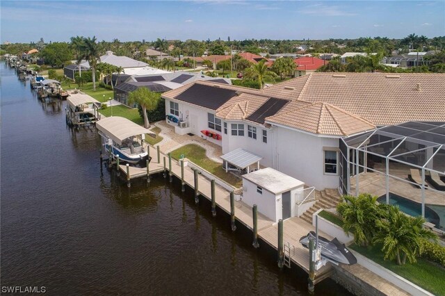 birds eye view of property with a residential view and a water view