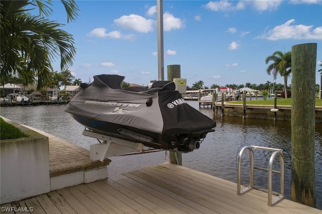 view of dock featuring a water view and boat lift