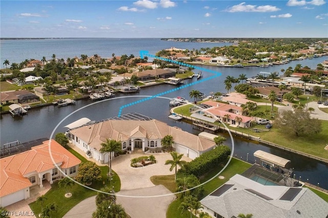 bird's eye view featuring a water view and a residential view