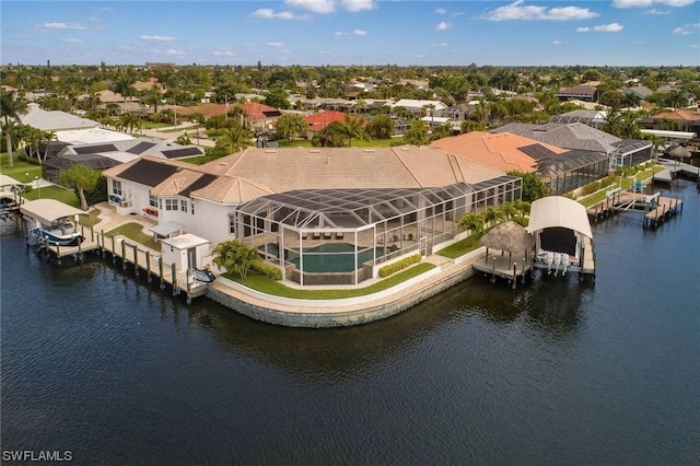 bird's eye view with a water view and a residential view