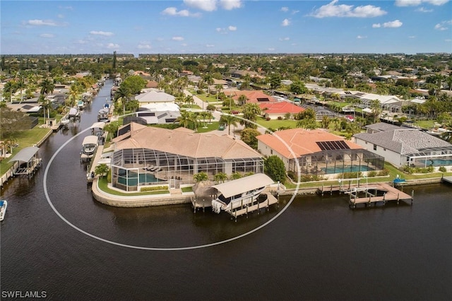 birds eye view of property with a residential view and a water view