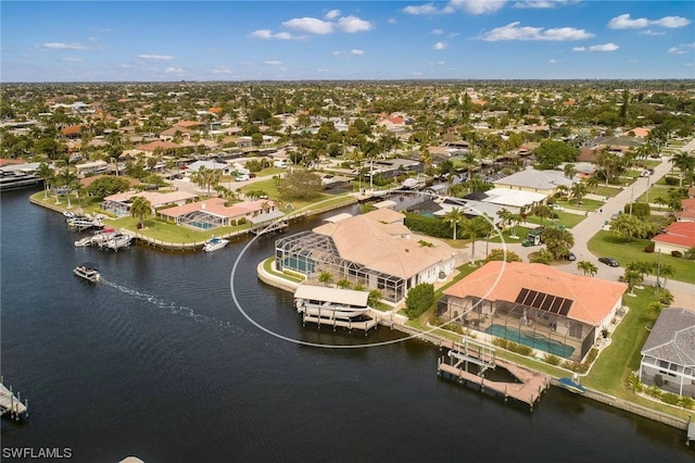 drone / aerial view with a water view and a residential view