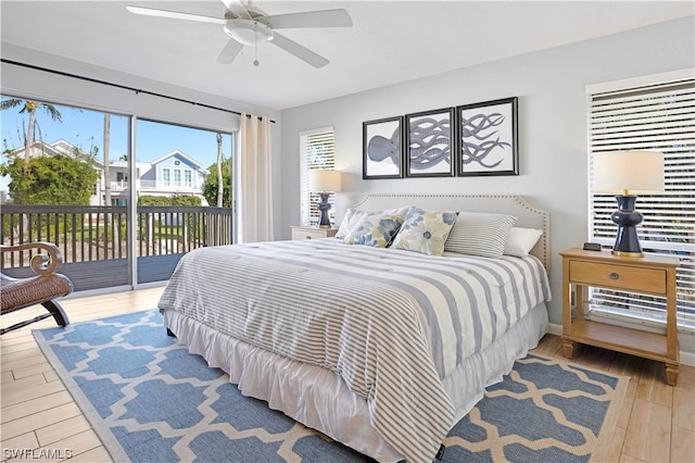 bedroom with light hardwood / wood-style floors, ceiling fan, and access to outside