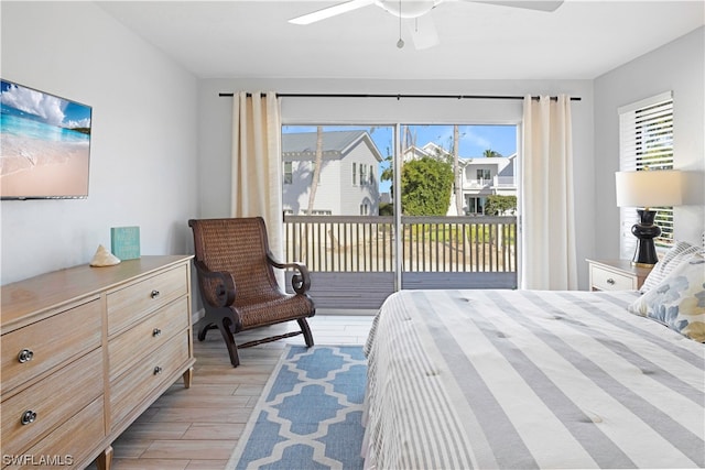 bedroom featuring ceiling fan, light hardwood / wood-style floors, and access to outside