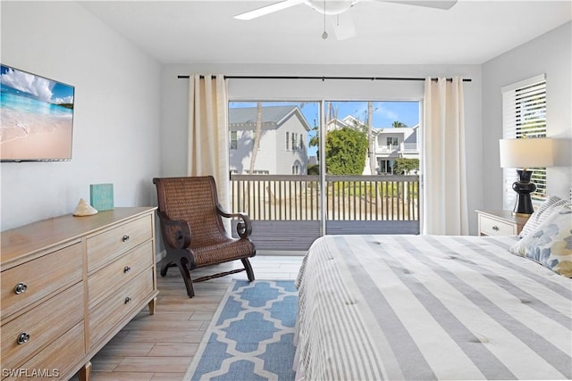 bedroom featuring access to exterior, a ceiling fan, and light wood finished floors