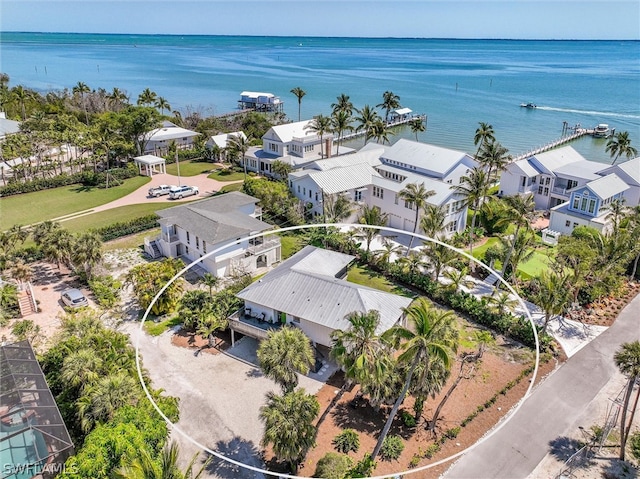 bird's eye view featuring a residential view and a water view