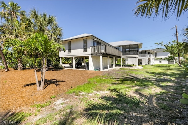 back of house with a sunroom