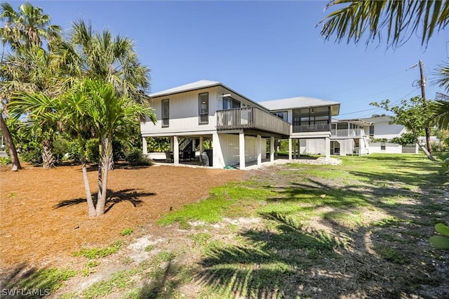 14865 Mango Ct, Captiva, FL 33924 - back of house with a sunroom