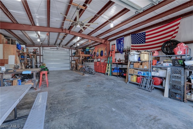 garage with ceiling fan and a workshop area