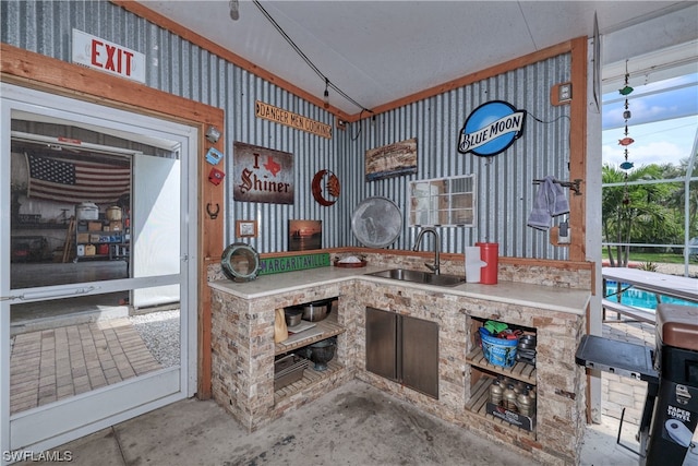 interior space featuring concrete flooring and sink