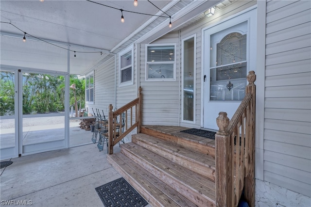 property entrance featuring a patio area