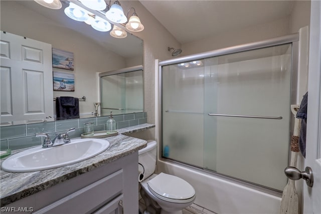 full bathroom with toilet, enclosed tub / shower combo, tasteful backsplash, a notable chandelier, and large vanity