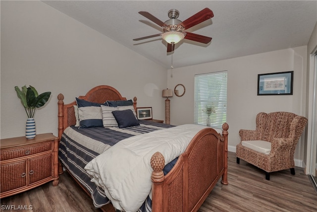 bedroom featuring dark hardwood / wood-style flooring and ceiling fan