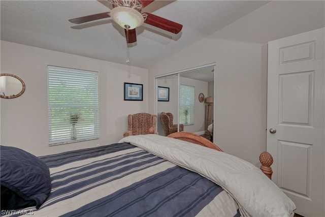 bedroom featuring a closet, ceiling fan, and vaulted ceiling