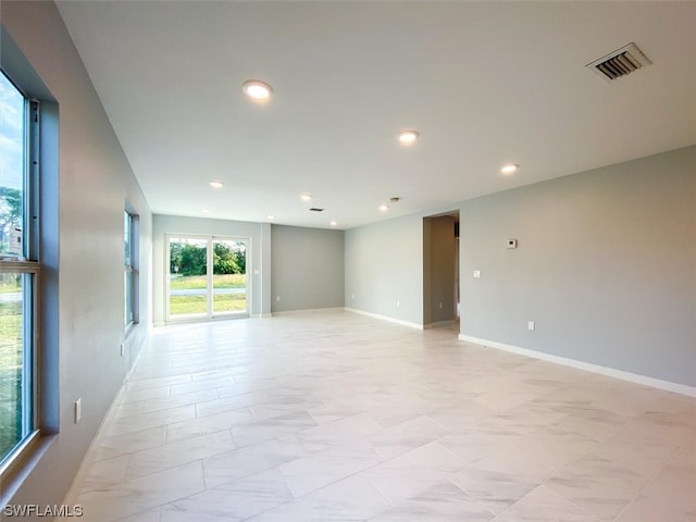 spare room with light tile flooring