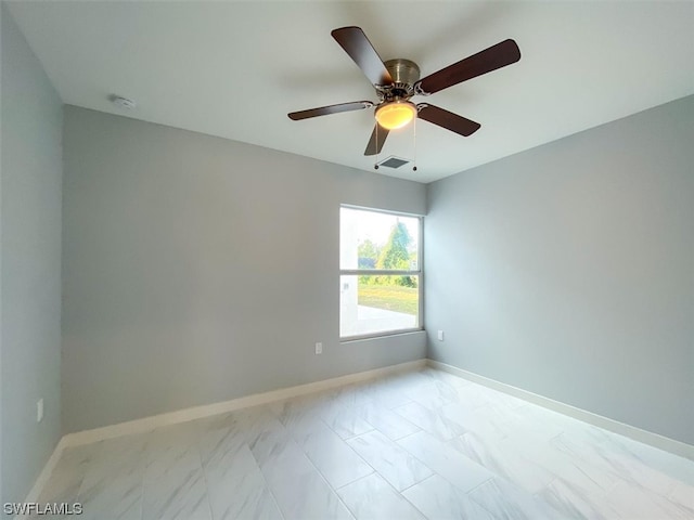 tiled empty room with ceiling fan