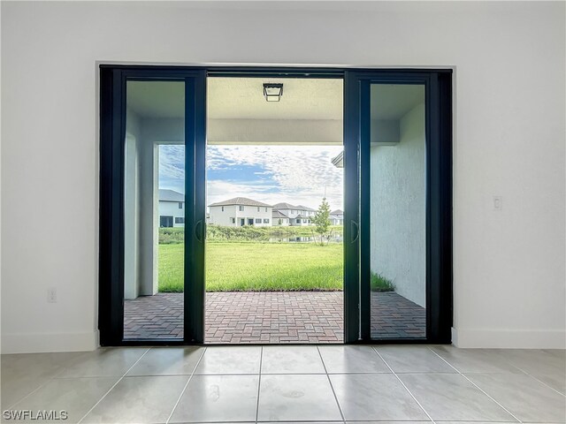 doorway featuring light tile floors