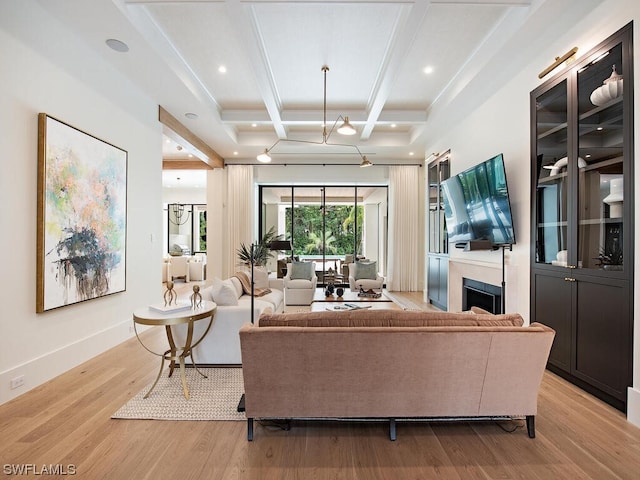 living room featuring coffered ceiling, beam ceiling, and light hardwood / wood-style floors