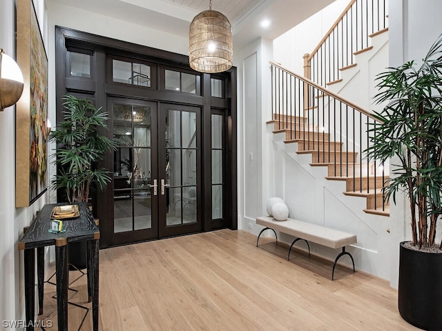 entryway featuring light hardwood / wood-style floors and french doors