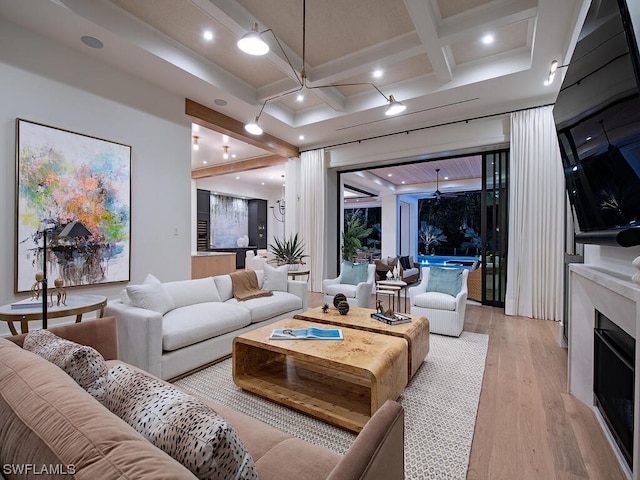 living room featuring coffered ceiling, beam ceiling, and light hardwood / wood-style flooring