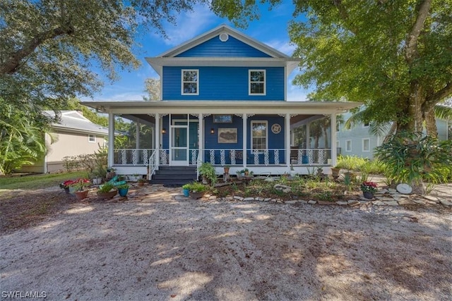 view of front of home with a sunroom