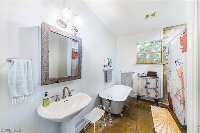 bathroom featuring sink and a shower with shower curtain