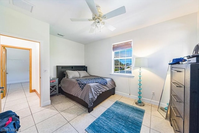 bedroom featuring light tile patterned floors and ceiling fan