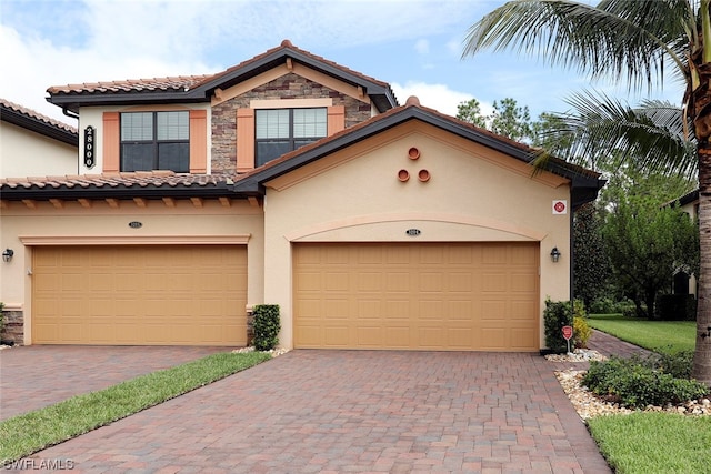 mediterranean / spanish-style house featuring a garage