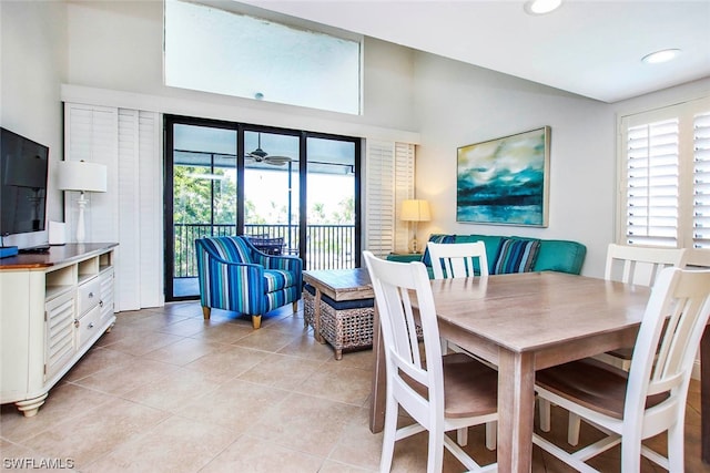 dining space featuring plenty of natural light, light tile flooring, and ceiling fan