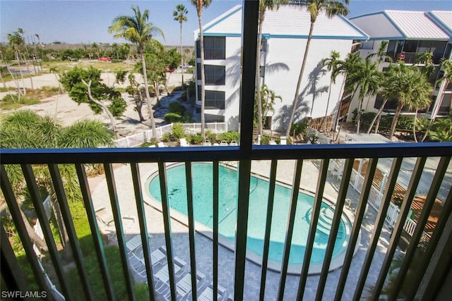 balcony featuring a community pool