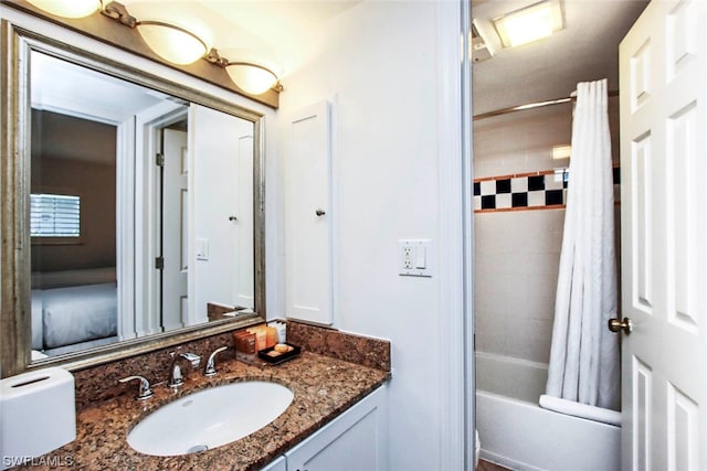 bathroom with large vanity and shower / bathtub combination with curtain