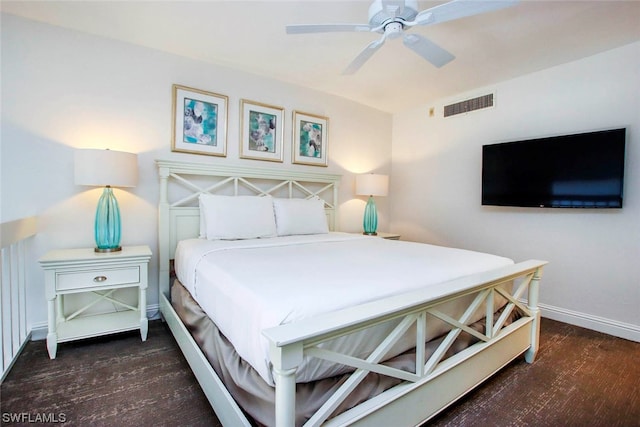 bedroom with ceiling fan and dark wood-type flooring