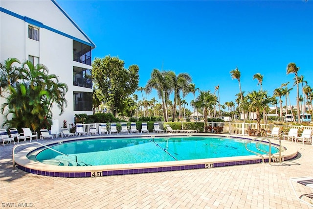 view of swimming pool featuring a patio area