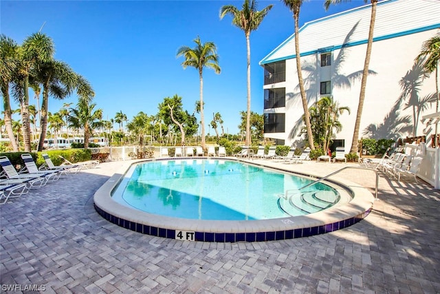 view of swimming pool with a patio