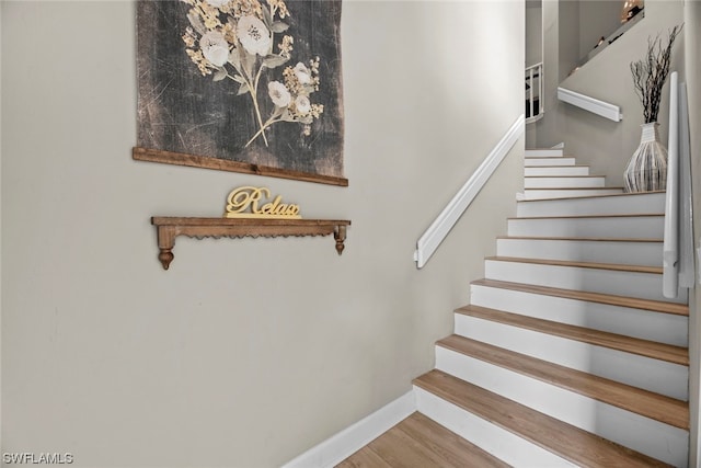 stairway featuring hardwood / wood-style flooring