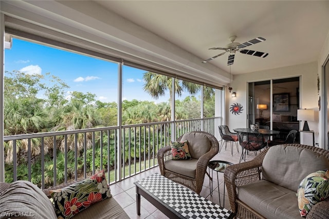 sunroom featuring ceiling fan