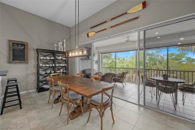 tiled dining area featuring ceiling fan