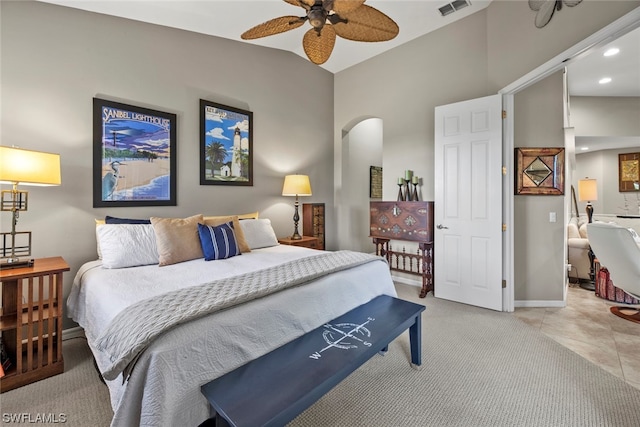 tiled bedroom with ceiling fan