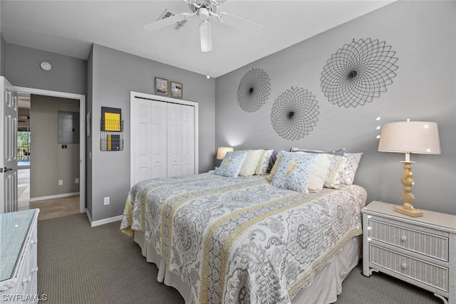 carpeted bedroom with a closet and ceiling fan