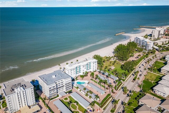 aerial view with a water view and a view of the beach