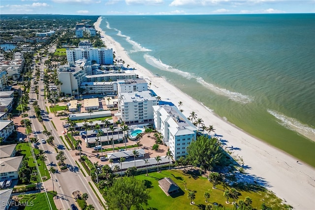 drone / aerial view featuring a view of the beach and a water view