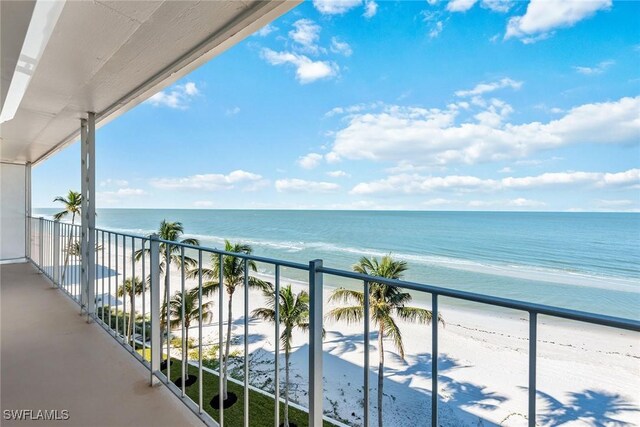 balcony with a view of the beach and a water view