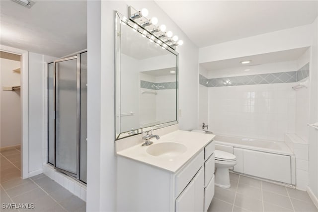 bathroom featuring tile patterned flooring, toilet, and vanity