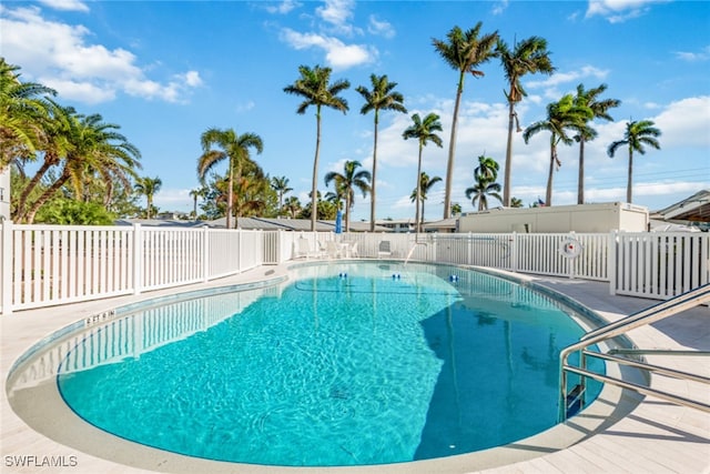 community pool featuring fence