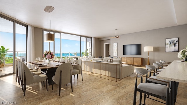 dining room featuring a wall of windows and a water view