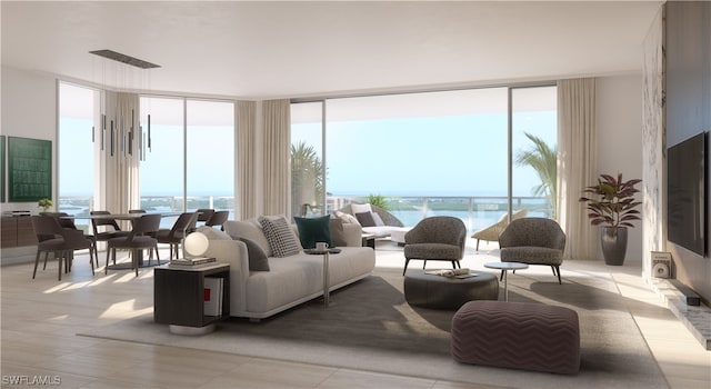 living room featuring expansive windows and a water view